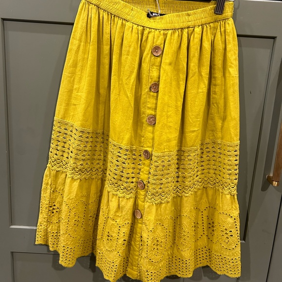 Greenish yellow skirt with elastic waist and wooden button detail. Size Small. - Picture 2 of 3